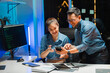 © Kritdanai - Collaborative Developers Working Late in Office