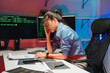 © Kritdanai - Stressed Woman Working Late on Computer Code