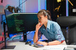 © Kritdanai - Focused Woman Coding at Night