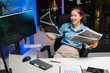 © Kritdanai - Smiling Asian Woman Analyzing Data Charts at Night