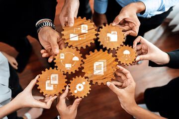 Poster - Diverse hands unite to hold gears symbolizing teamwork and management. The image captures the essence of collaboration and innovation in a professional setting. Amity