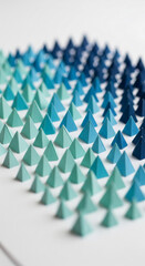 Poster - Numerous small teal and blue pyramids arranged in gradient pattern on white background, showcasing texture and color transition, ideal for design or presentation