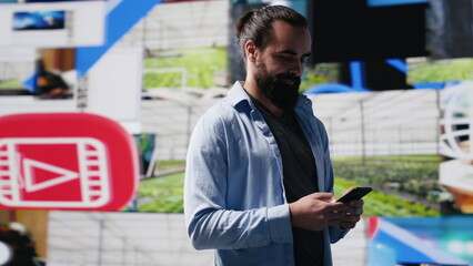 Poster - Modern online lifestyle of a young man checking real time notifications, enjoying interaction with followers and posting creative content in a social network environment. Camera A.