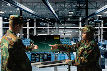 Poster - Army soldiers in data center using digital crosshairs to lock onto enemy targets. Military units in server hub command room looking at tactical software screen on monitor