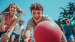 © Pixel Design Aura - Group of friends playing dodgeball outside on a sunny day with a red ball in the foreground focus