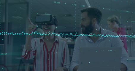 Poster - Collaborating tech duo using VR headset and laptop at office, showing holographic overlay