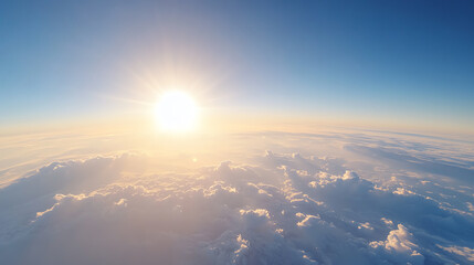 Aufkleber - Breathtaking aerial view of the sun rising above fluffy clouds, offering a serene and tranquil atmosphere in the vast sky.
