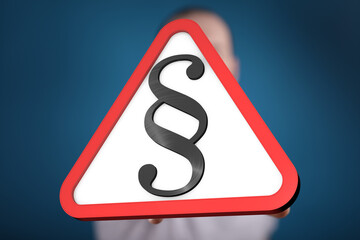 Poster - Image of a person holding a red triangle warning sign with a paragraph symbol.  Ideal for legal, law, or regulation concepts.