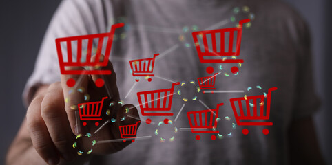 Poster - Hand interacts with a digital network of shopping carts, symbolizing online shopping and e-commerce.