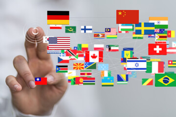 Aufkleber - A hand interacts with a digital network showing flags of many countries, symbolizing global interconnectedness.