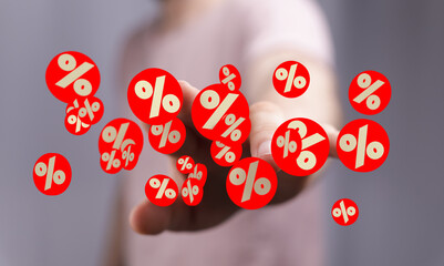 Poster - Image of a hand holding many red percentage symbols. Perfect for discount, sale, or marketing concepts.