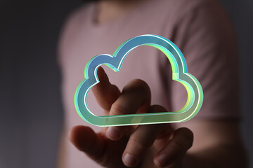 Poster - Person using finger to interact with a digital cloud icon, representing cloud computing and technology.
