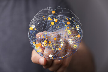 Poster - Abstract image of a hand holding a digital network. Represents connection, technology, and global communication.