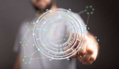 Aufkleber - A person uses a finger to interact with a holographic data visualization interface displaying circular charts and percentage values.