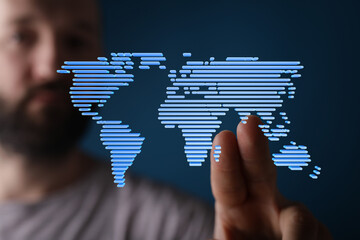 Poster - Man interacts with digital world map, illustrating global connectivity and technology.
