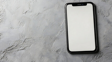 Smartphone with blank white screen showing on gray concrete background