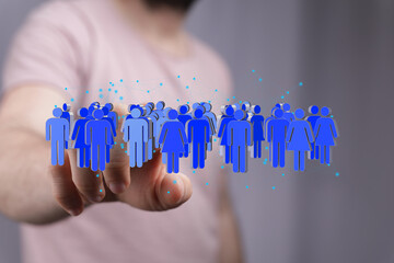 Leinwandbilder - Image depicting a hand interacting with a digital network of diverse people. Ideal for business, teamwork, and global community concepts.