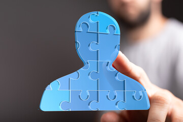 Leinwandbilder - Abstract image of a person made of puzzle pieces, symbolizing teamwork and collaboration.