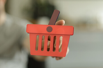Aufkleber - Red shopping basket icon in hand, symbolizing online shopping, e-commerce, and digital purchases.