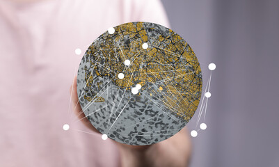Aufkleber - Abstract image of a person holding a global network map, illustrating worldwide connectivity and city infrastructure.
