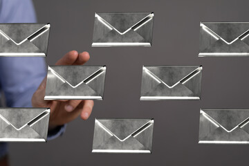 Poster - Image depicts a hand reaching for multiple digital email icons, symbolizing email management and inbox overload.