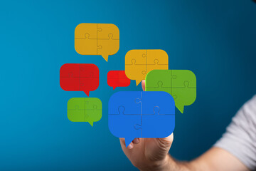 Poster - Colorful puzzle pieces forming speech bubbles. Teamwork, ideas, solutions.