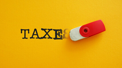 Poster - Tax reduction is shown with the erasing word Taxes