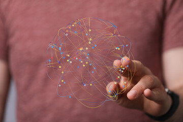 Poster - A hand interacts with a digital sphere representing a network.  Ideal for technology, connection, and global concepts.