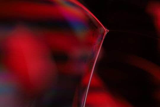 Red reflections of liquid in macro, red liquid surface, bubbles in macro, connection of bubbles in macro, cell from liquid, horror background