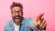 © svastix - A cheerful man with a stylish beard is laughing and pointing, exuding positivity and enthusiasm, embodying a carefree and vibrant spirit captured in a moment.