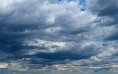 Wall Mural - dark dramatic sky with stormy clouds before rain as abstract background, extreme weather