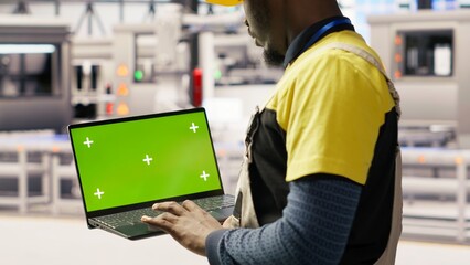 Poster - solar panels factory engineer analyzes performance data with green screen laptop to predict gear fai