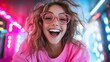 © svastix - A joyful young woman exudes happiness with a vibrant smile, her playful spirit captured against a backdrop of colorful lights, radiating positivity and energy.