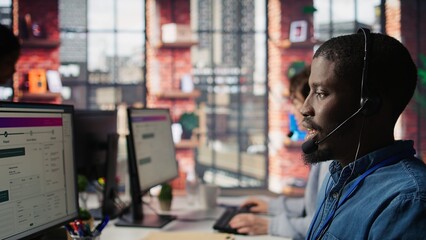 Poster - Diverse customer center workers assisting clients with installing software. Multiethnic team of call center agents using remote access tools to connect to customer devices, fixing errors, camera B