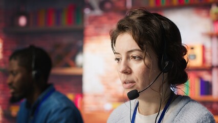 Poster - Customer support workers doing upselling, recommending products to clients during conversation. Call center agents contact prospects to inform them about new services and promotions, camera A close up