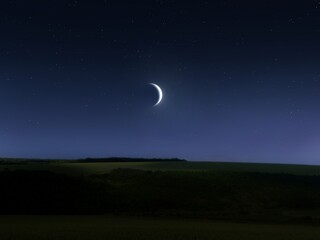 night landscape with moon in the sky. bright crescent moon over the top of the hill. dreamy view.
