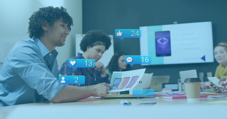 Poster - Pointing designer wearing blue shirt holding swatches at office table with digital metrics overlays