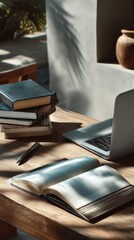 Poster - Cozy rustic workspace with open book laptop and stack of hardcover books on wooden desk illuminated by natural sunlight