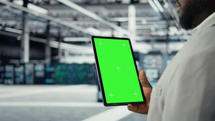 Poster - Data center IT expert uses mockup tablet, reviewing performance dashboards of equipment rigs. Server room manager overseeing systems, examining infrastructure on chroma key device, camera A closeup