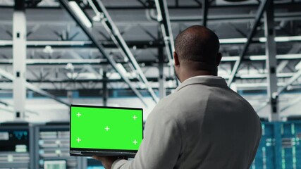 Poster - Data center admin using isolated screen laptop to monitor neural network AI. Server room employee using mockup notebook to oversee rigs powering machine learning processes, camera B