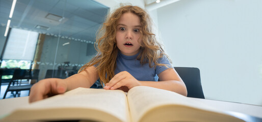 Aufkleber - Child reading book at library. Kid studying and reading. Smart kid read book. Little student learning from book. Child reading book in library. Education and Learning. Knowledge through reading.