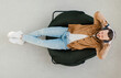 © Prostock-studio - Top View Of Relaxed Guy Wearing Wireless Earphones Listening To Music Or Online Podcast Resting With Eyes Closed Lying In Chair At Home. Weekend Leisure And Relaxation Concept