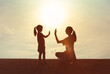 © kieferpix - Mother giving daughter high five. Parent child relationship concept. Family support, childhood,  trust togetherness, bonding, Love, motherhood concept