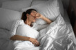 © kieferpix - Sleepless woman opening eyes waking up in the bed can't sleep ant night time from symptom of depression stress