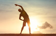 © kieferpix - Young man stretching exercising at sunrise. flexibility, body health fitness,  exercises, healthy active lifestyle concept