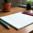 © Елена Сайкина - Blank sketchbook with colored pencils and plants on a wooden table, creative concept
