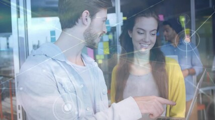 Poster - male tapping pointing laptop screen, woman watching network nodes appearing, collaborating on tech