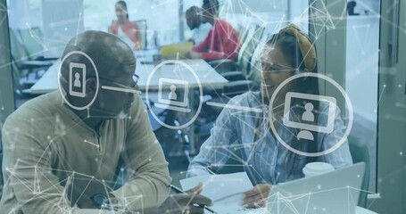 Poster - Senior manager tapping document sparking network overlay while colleague writing business notes