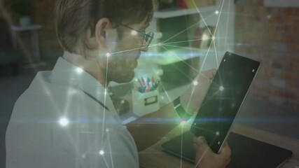 Poster - Office worker lifting tablet from home desk, revealing network overlay while examining interface