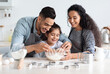 © Prostock-studio - Cute arab family baking pastry together at kicthen, copy space. Joyful middle-eastern father, mother and little daughter making dough for home-made cookies. Domestic family lifestyle concept